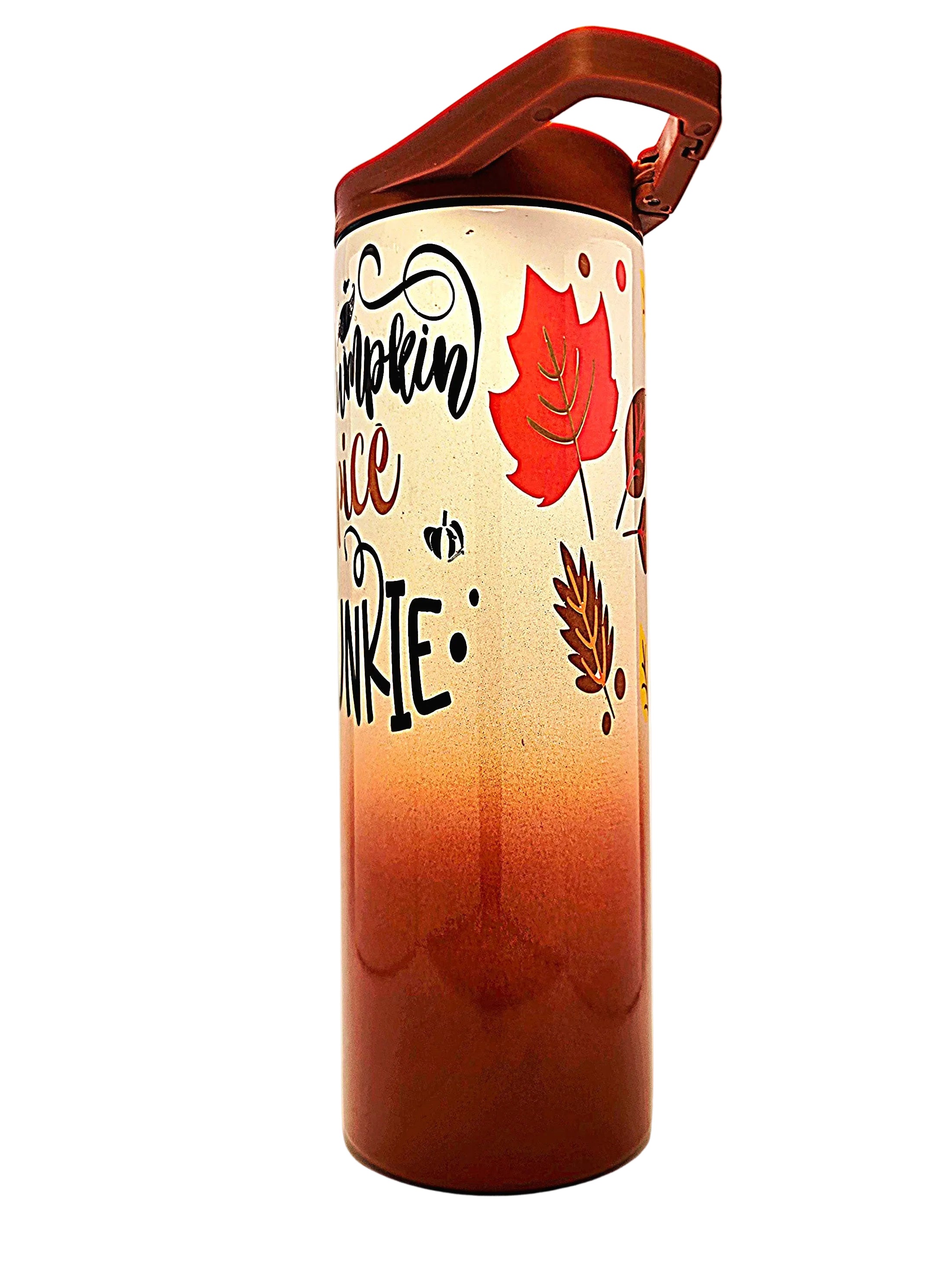 A tall insulated tumbler with a dark orange lid and carry loop, featuring an autumn-themed design with a red maple leaf, brown leaf, and the words 'Pumpkin Spice Junkie' on a white-to-dark orange gradient body, set against a plain light background.