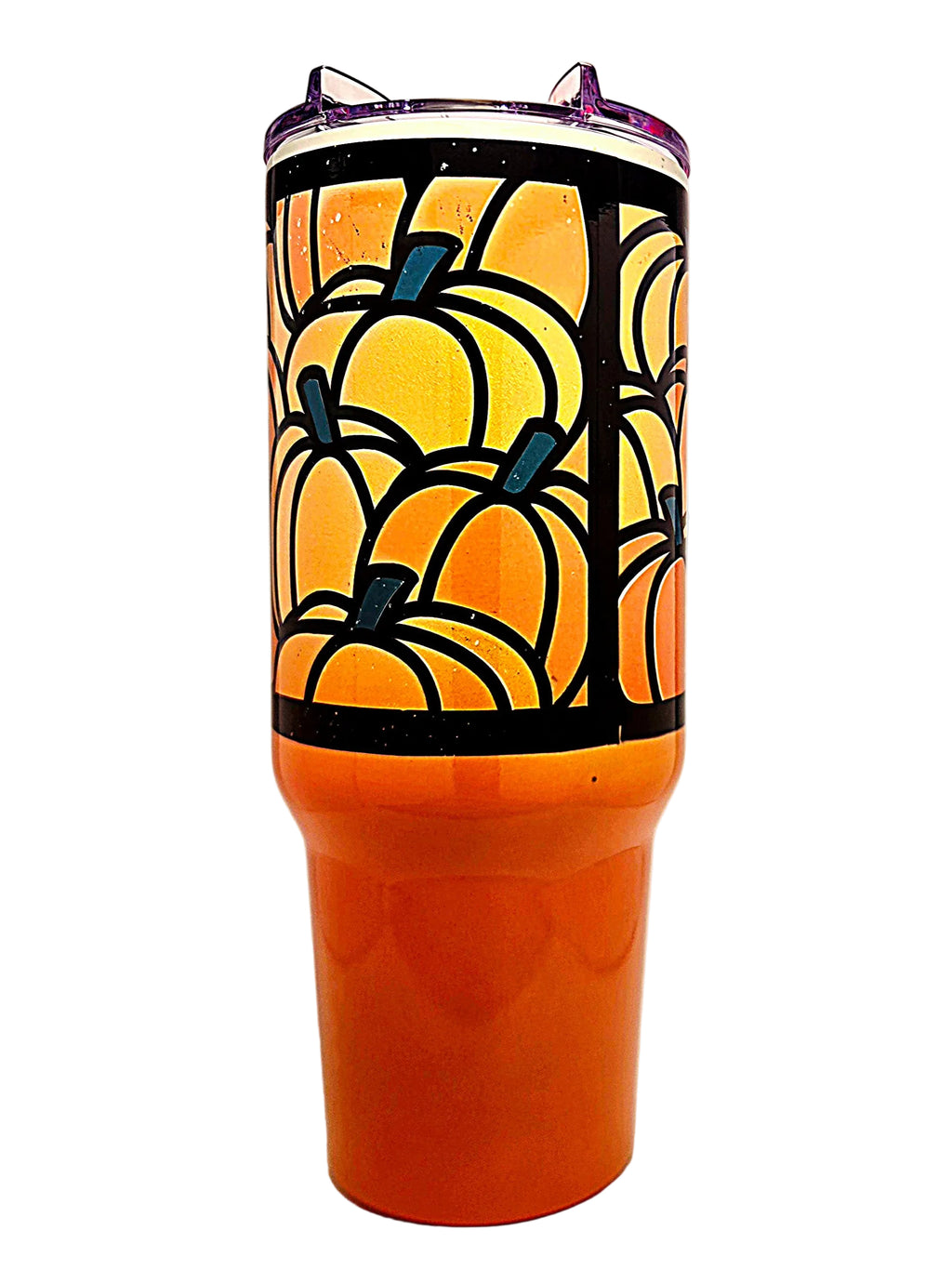 An orange insulated tumbler with a stained-glass style pumpkin pattern on the upper half and a clear lid.