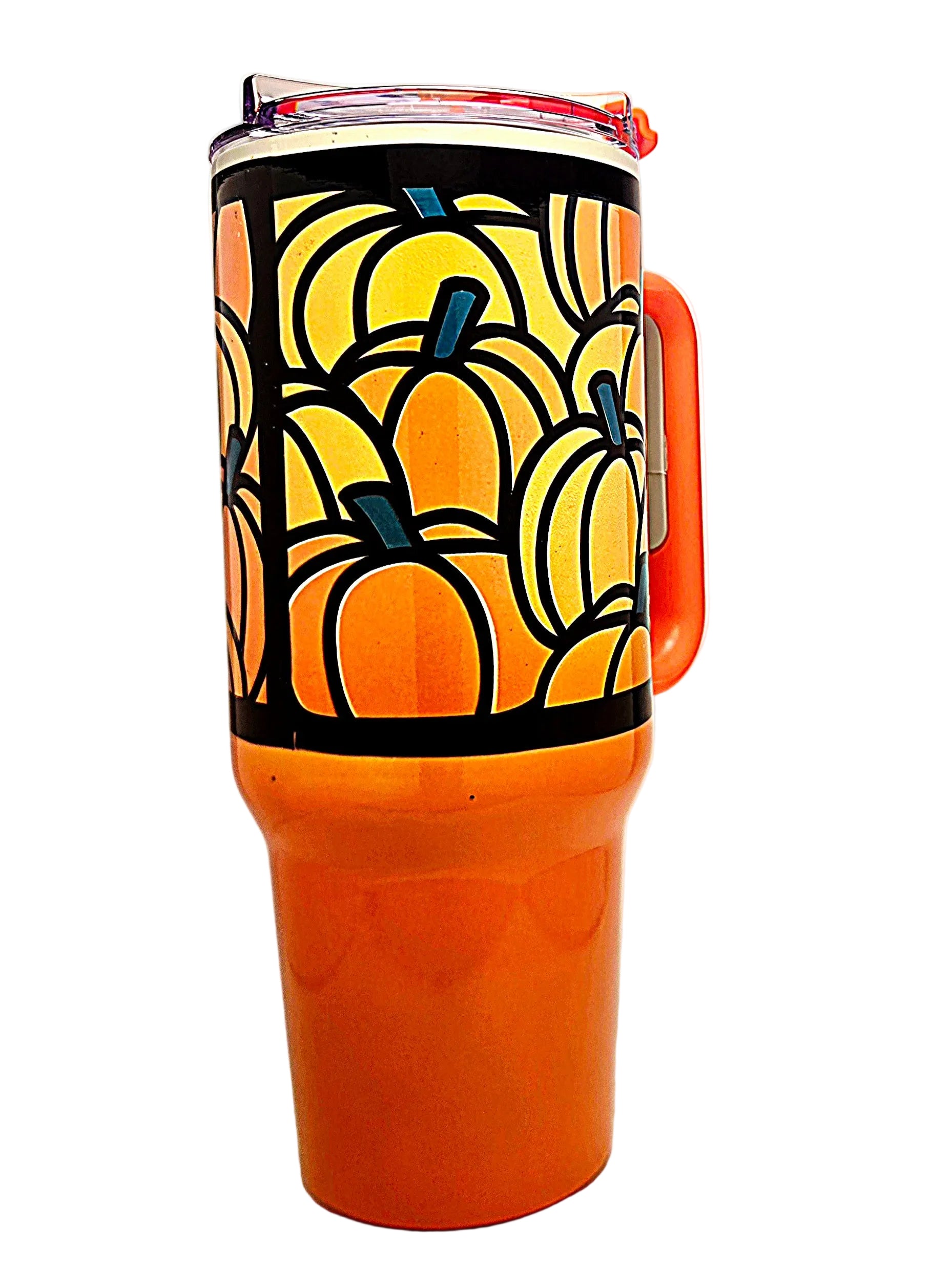 An orange insulated travel tumbler with a handle, featuring a black band decorated with a stylized pumpkin pattern in orange.