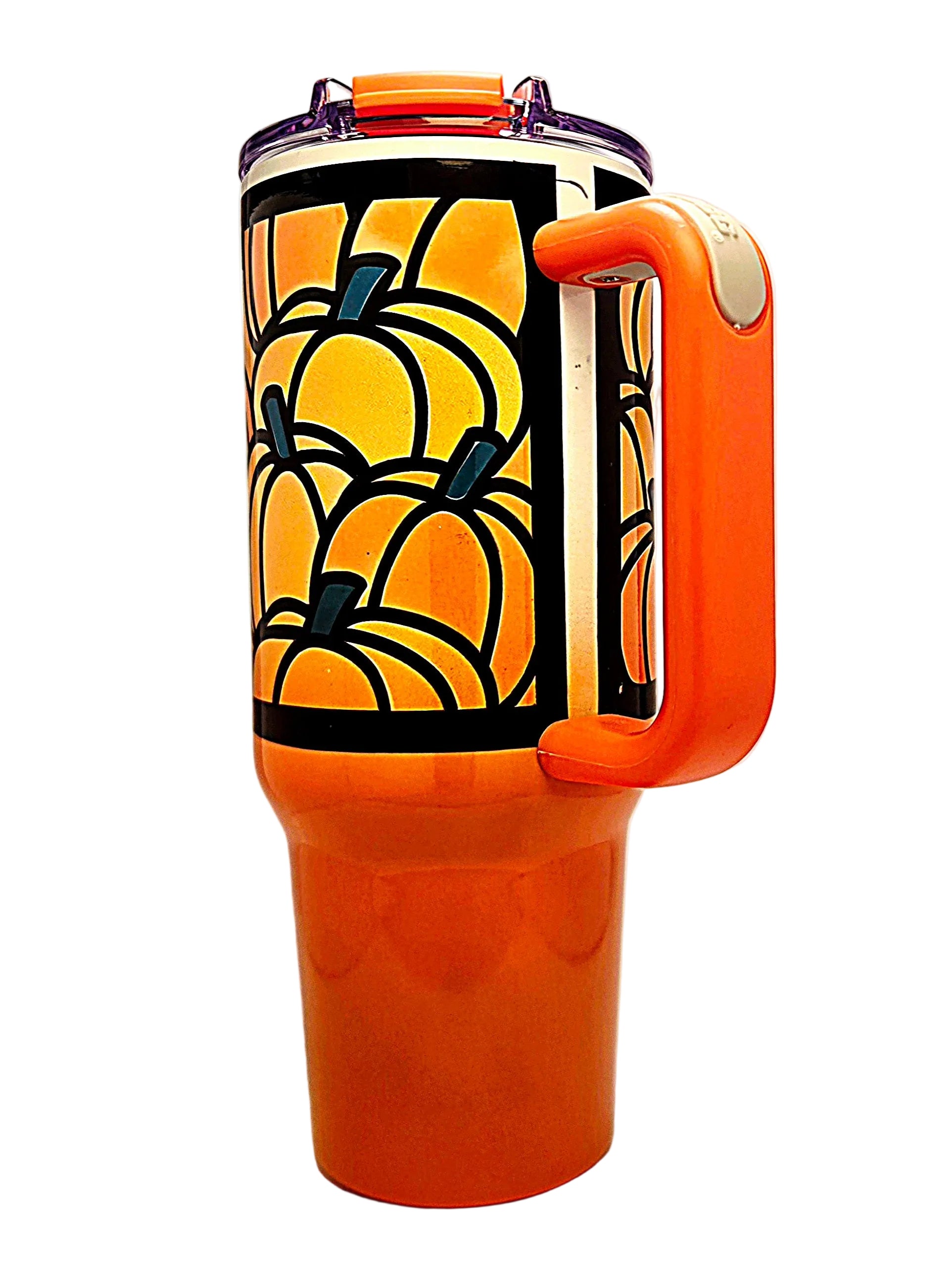An orange handled travel tumbler with a clear lid and a printed pumpkin design on the upper section.