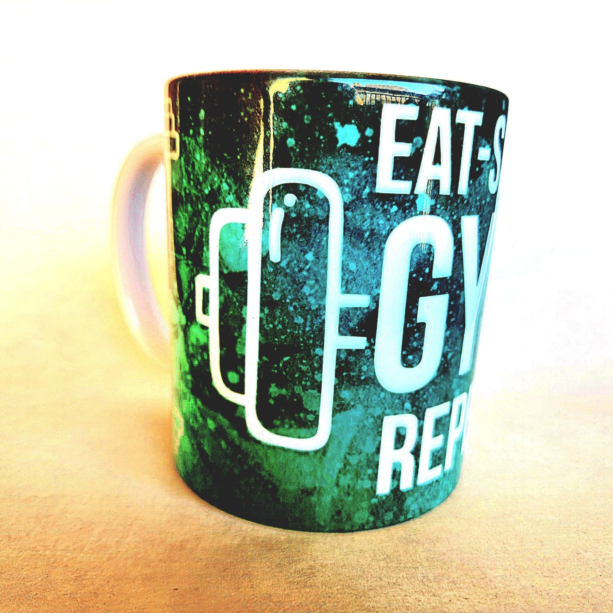 12oz Eat Sleep Gym Repeat edition ceramic coffee mug: Fitness Motivation - Coffee Quips Custom Drinkware