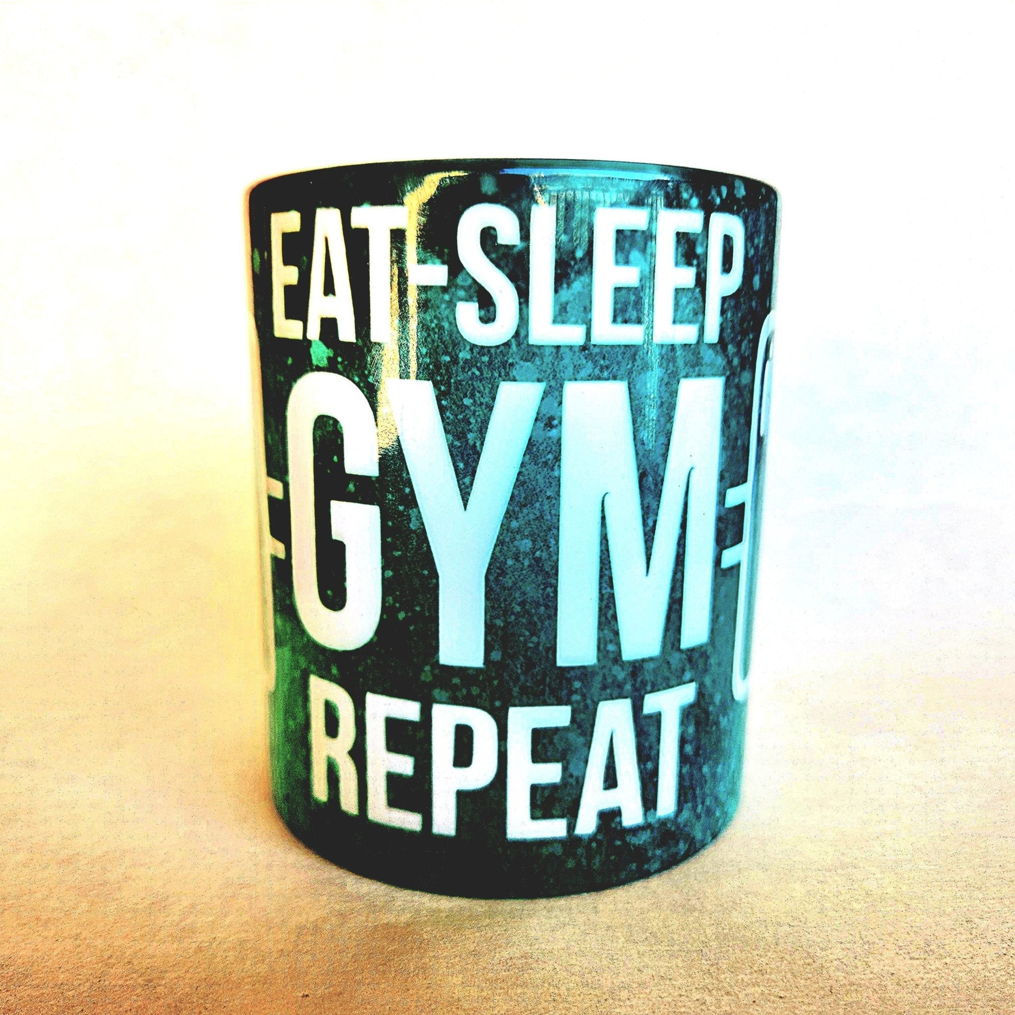 12oz Eat Sleep Gym Repeat edition ceramic coffee mug: Fitness Motivation - Coffee Quips Custom Drinkware